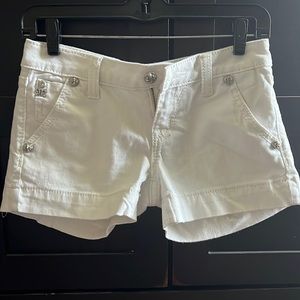 Miss Me white shorts with studded pockets.
